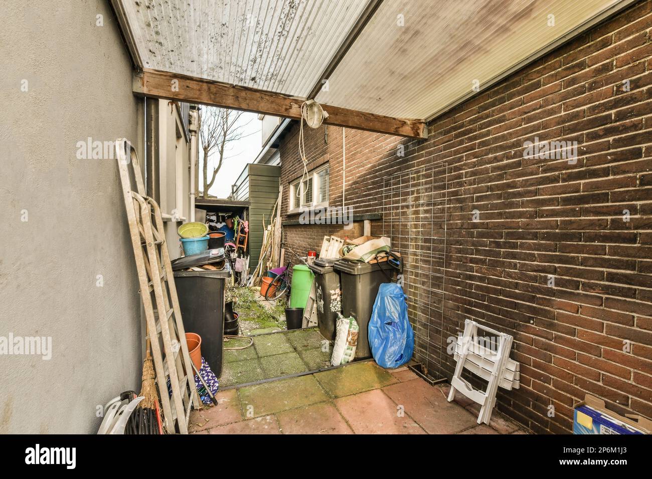 a back yard with trash and other items on the ground in front of a ...