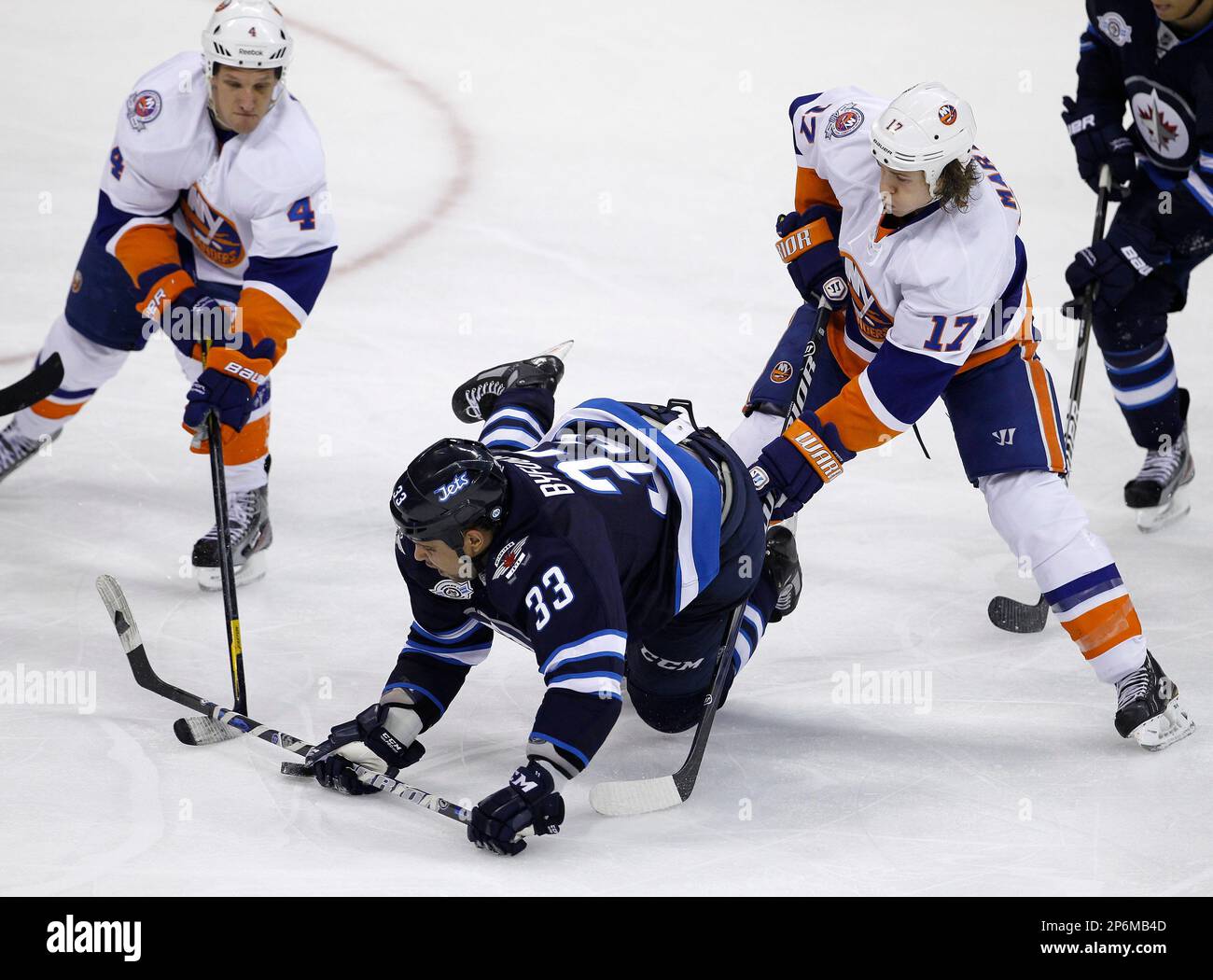 Winnipeg Jets' Dustin Byfuglien (33) stands up to a check by