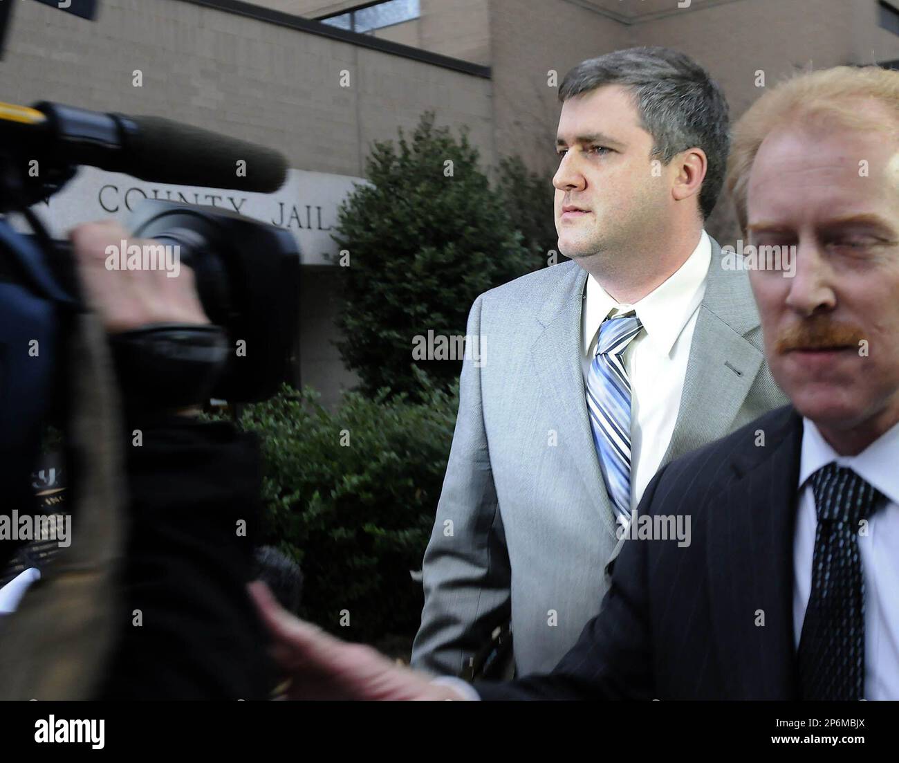 Gabe Watson and defense attorney Michael Hanle leave the Mel Bailey