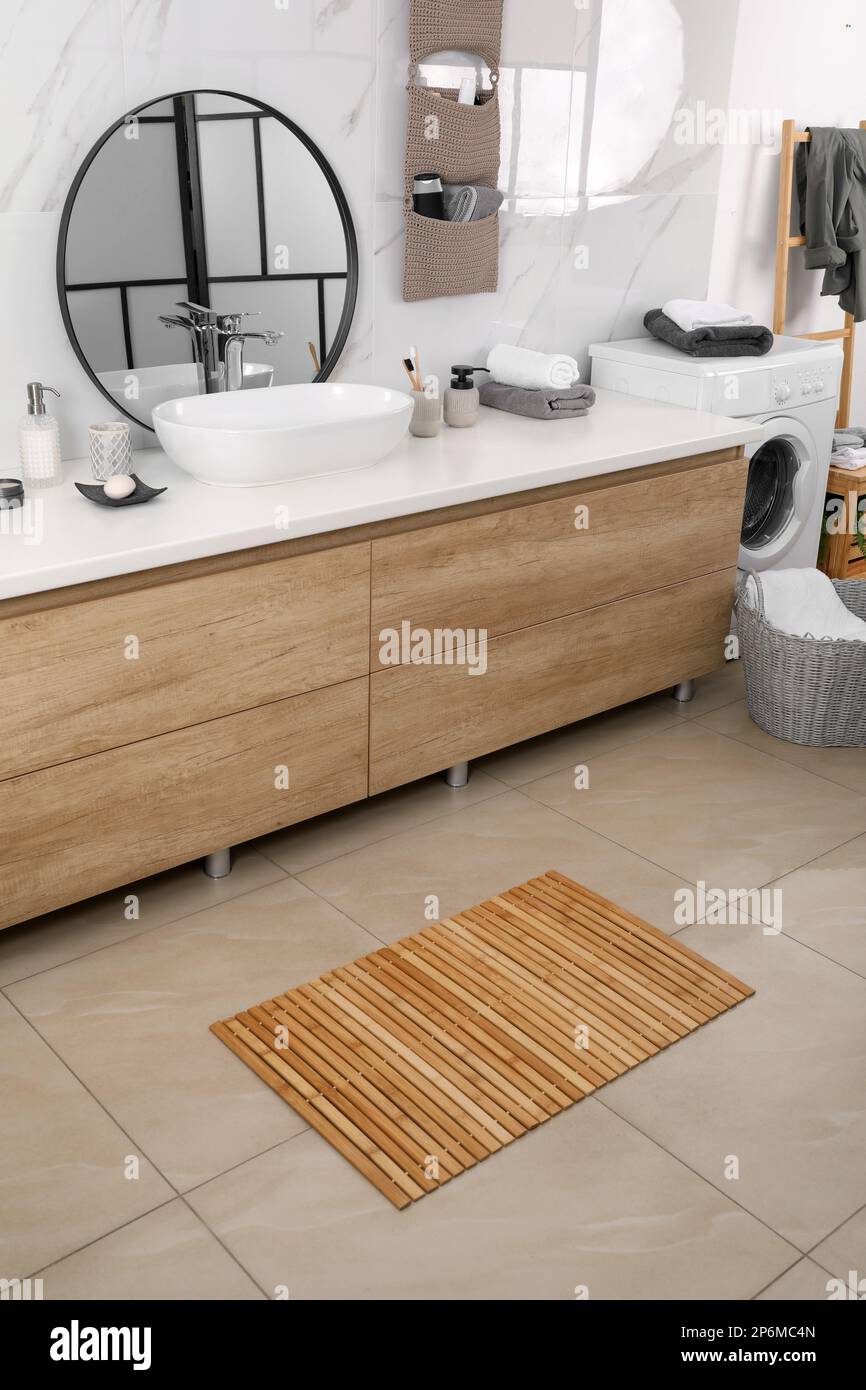 Wooden mat on floor in bathroom. Interior design Stock Photo - Alamy
