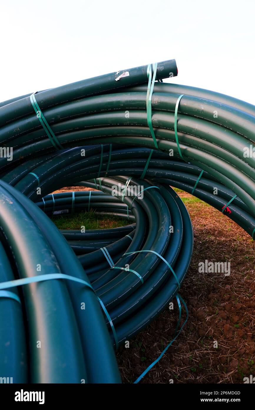 Pipe laying.Green water pipes set.Plumbing plastic flexible pipes in
