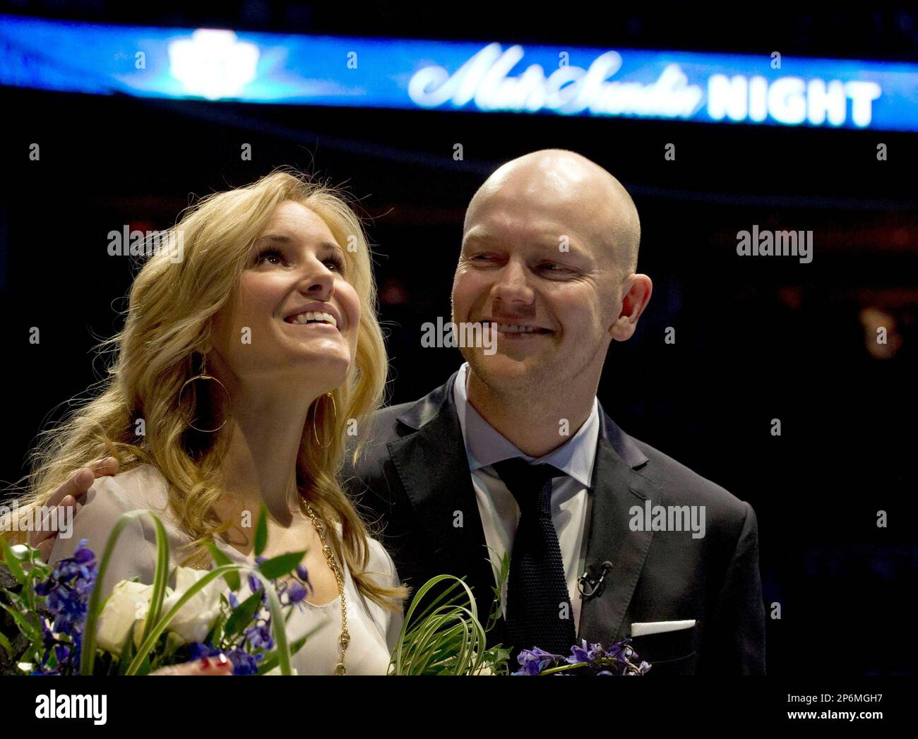 Former Toronto Maple Leafs captain Mats Sundin looks over at his wife, Josephine Johansson, as she watches his No. 13 is raised to the rafters prior to an NHL hockey game between the Maple Leafs and the Montreal Canadiens in Toronto on Saturday, Feb. 11, 2012. (AP Photo/The Canadian Press, Frank Gunn) Stock Photo
