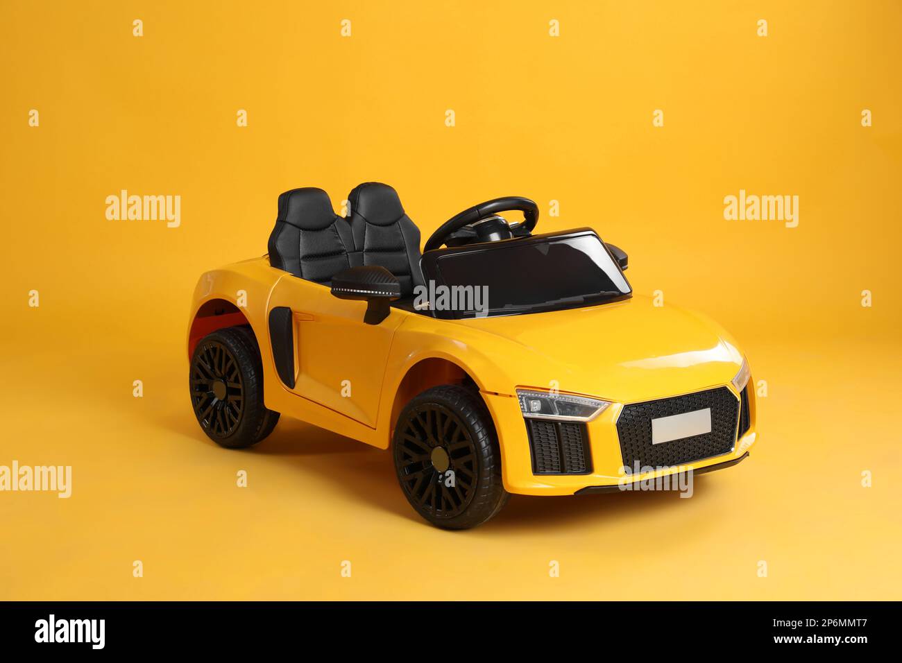 New bright toy car on yellow background Stock Photo Alamy