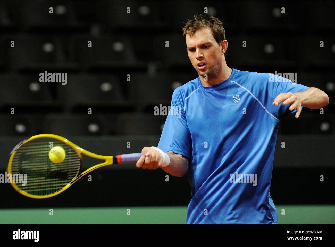 US Davis Cup tennis player Mike Bryan plays a ball during a training  session in the Forum Arena in Fribourg, Switzerland, Monday, Feb. 6, 2012.  Switzerland faces US the World Group first