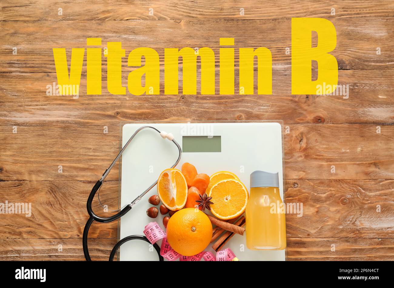 Healthy products, stethoscope, scales and text VITAMIN B on wooden background Stock Photo