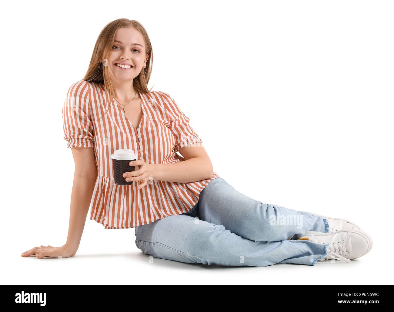 Beautiful girl with cup of coffee sitting on white background Stock ...