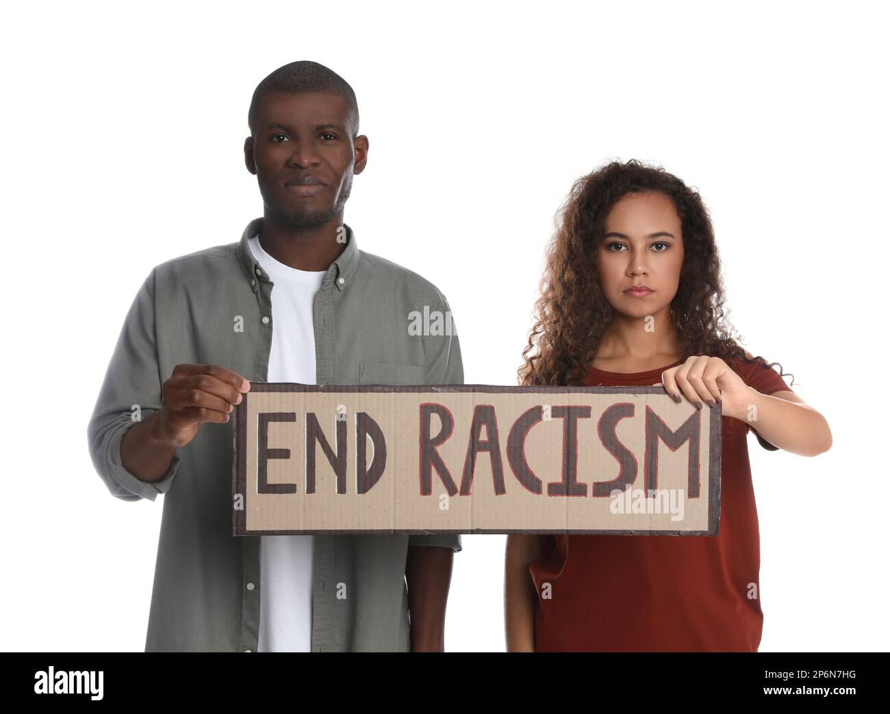 African American woman and man holding sign with phrase End Racism on white background Stock Photo