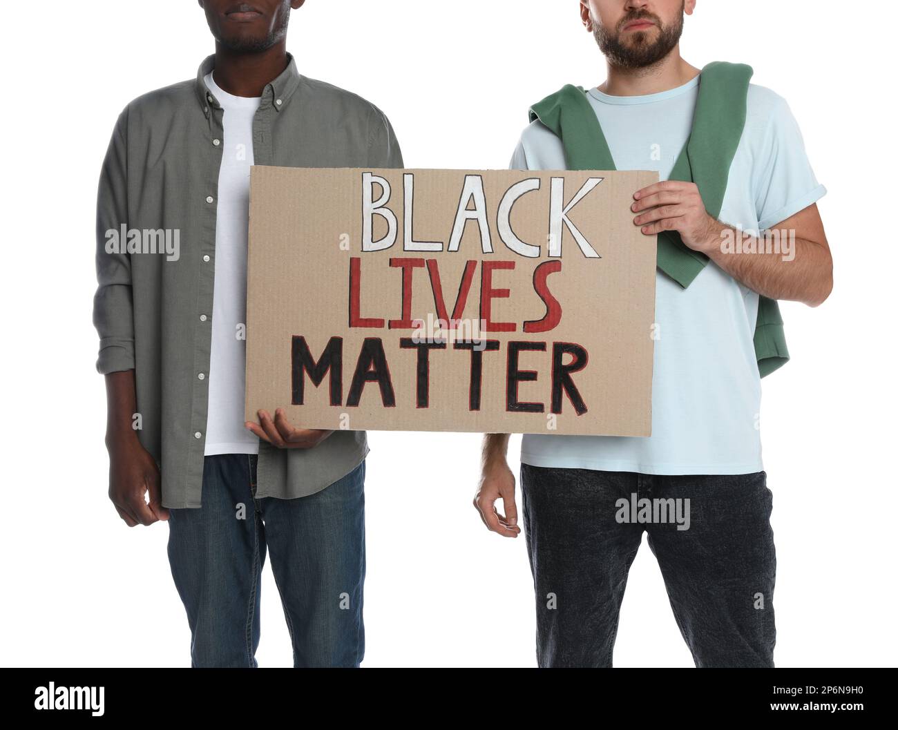 Men holding sign with phrase Black Lives Matter on white background, closeup. Racism concept Stock Photo