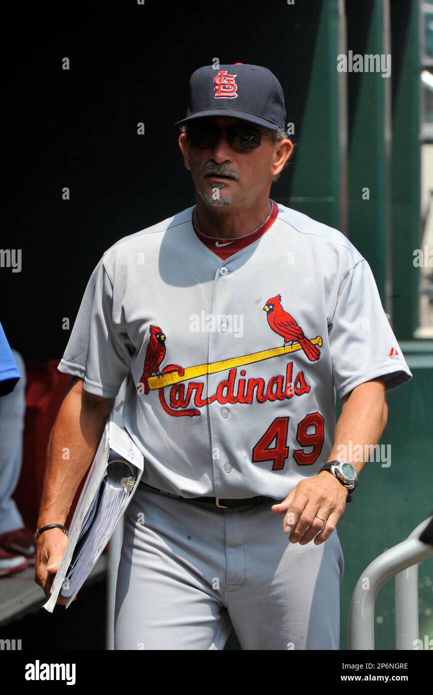 St. Louis Cardinals third base coach Jose Oquendo walks in the dugout  wearing the uniform of the St. Louis Stars of the Negro League before a  baseball game against the Pittsburgh Pirates