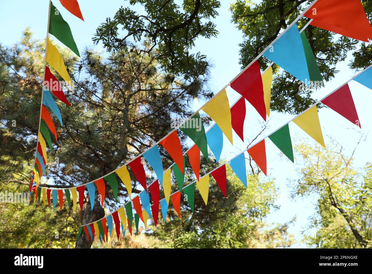 Colorful bunting flags in park. Party decor Stock Photo Alamy
