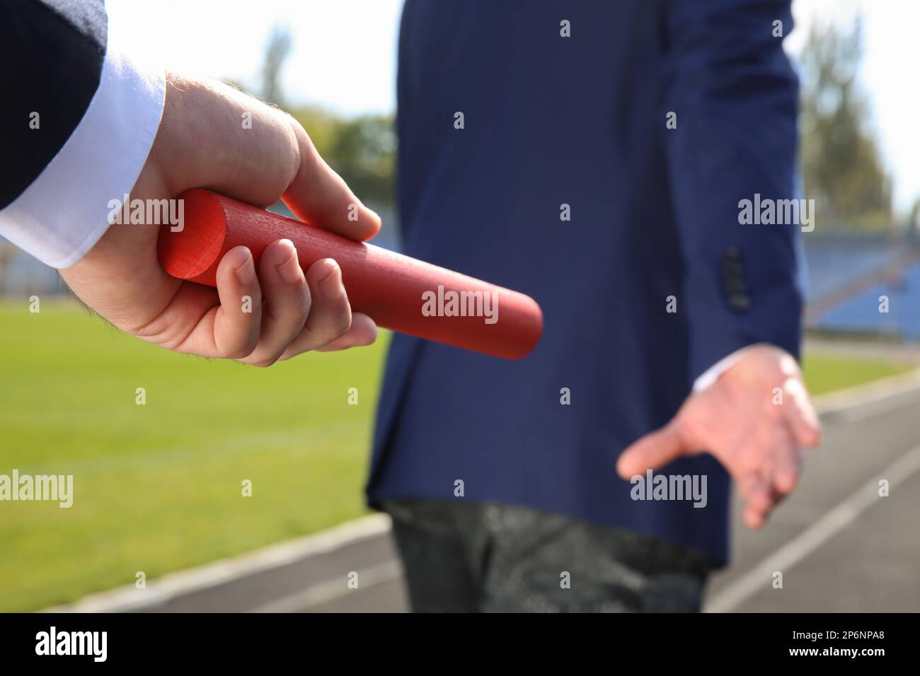 Teamwork passing baton hi-res stock photography and images - Alamy