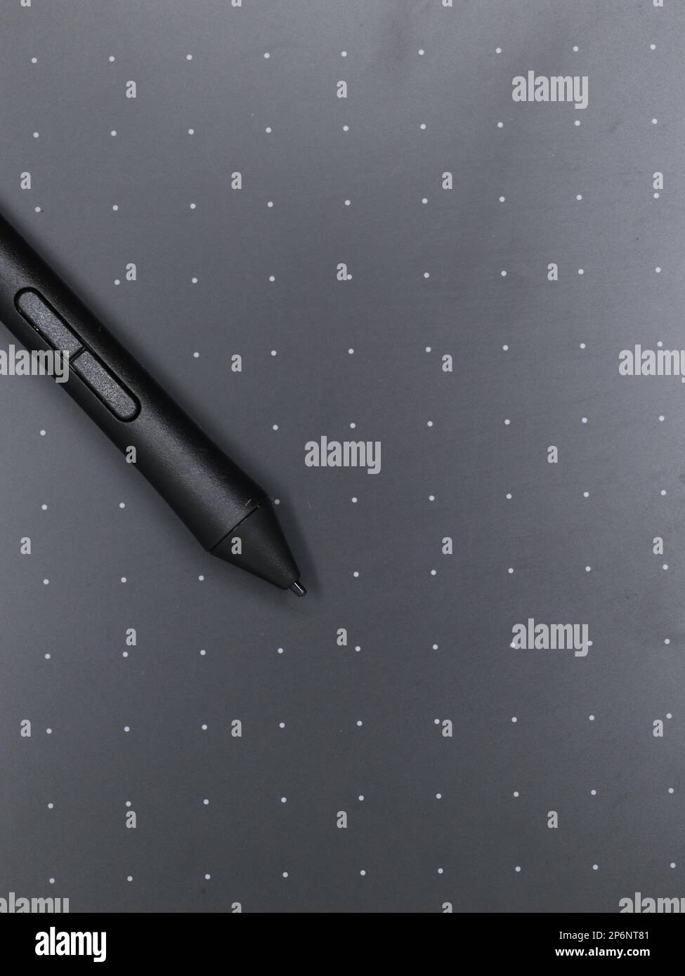 closeup of a black digital stylus touch pen tool on a sketching tablet