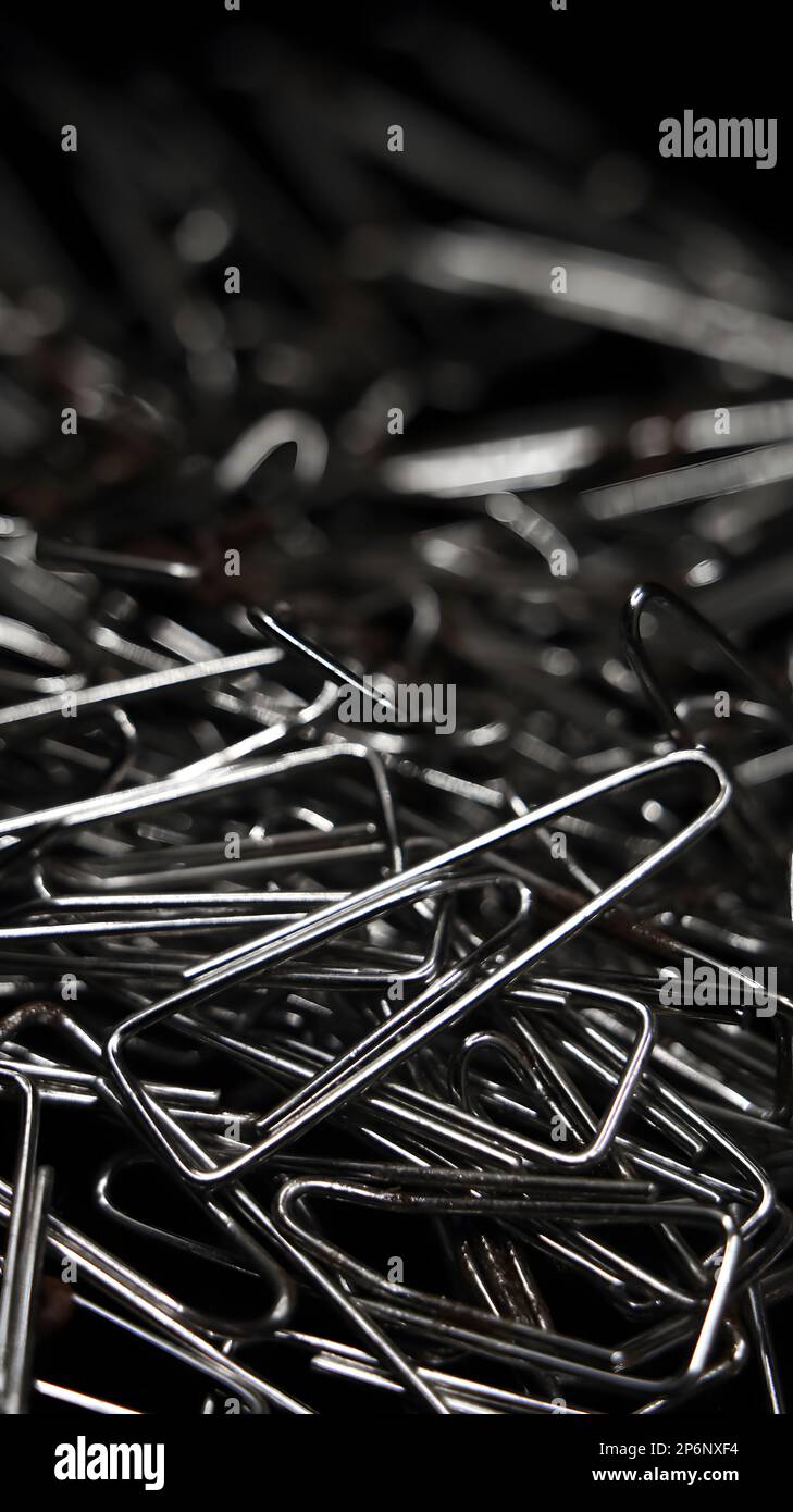 closeup macro shot of a large pile of triangular shaped shiny silver