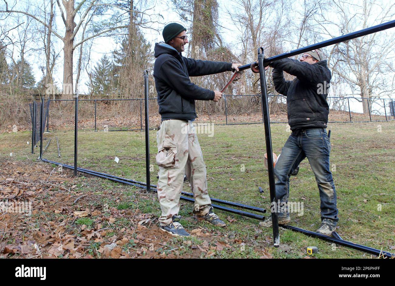 At left Chris Aldridge and Marty Webb of McNeil Fence Company use