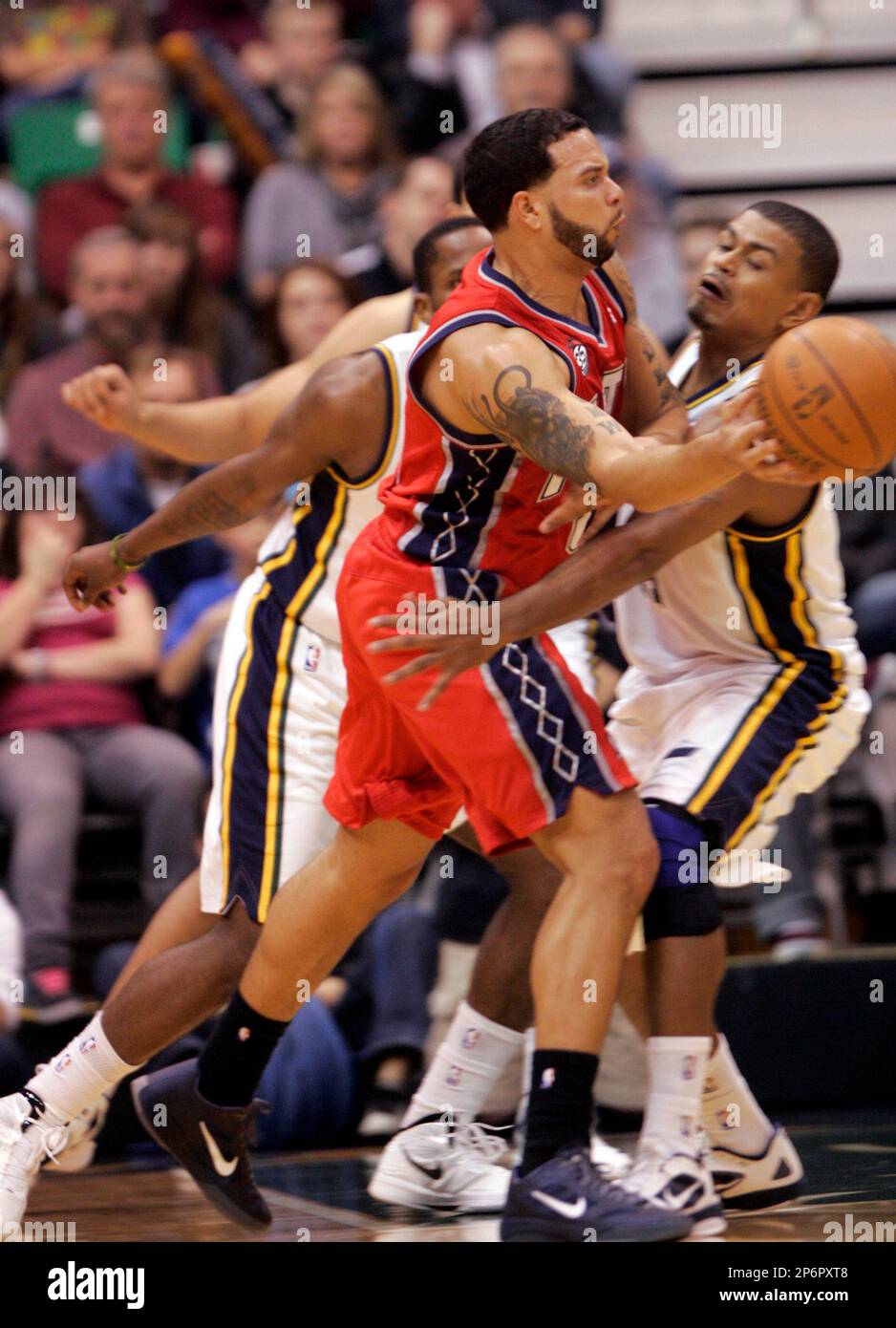 Utah Jazz player Earl Watson defends New Jersey Nets player Deron Williams  during the first half at Energy Solutions Arena in Salt Lake City, Utah on  January 14, 2012. (AP Photo/The Salt