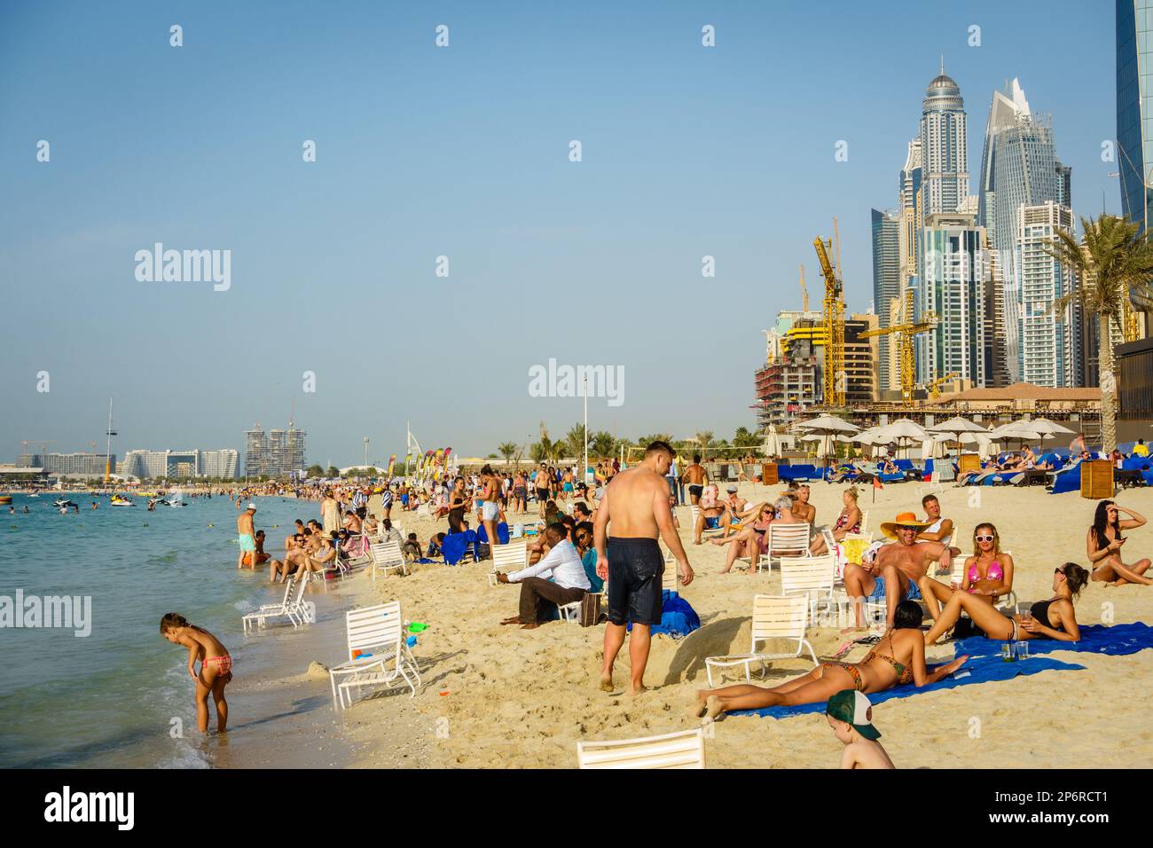 Dubai, UAE, February 23, 2018: Crowded beach at Jumeirah Beach Residence in Dubai, UAE Stock Photo