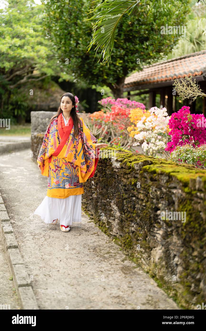 Woman wearing Uchinaasugai, Ryusou, Ryuso, traditional dress of Ryukyu Islands, Okinawa Stock Photo