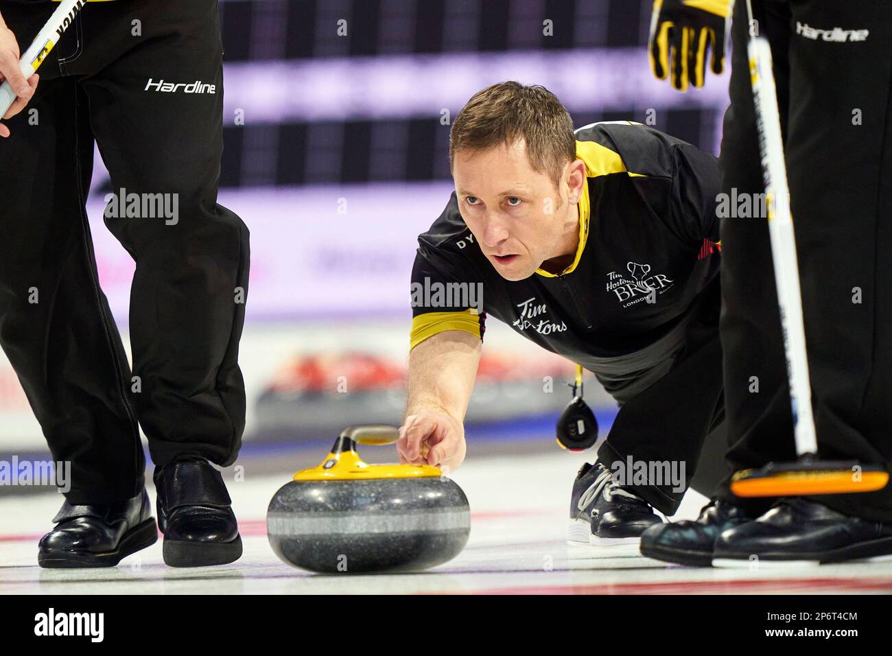 New Brunswick Second Brian King delivers a shot during his match against British Columbia at the Tim Hortons Brier curling event Tuesday, March 7, 2023, in London, Ontario