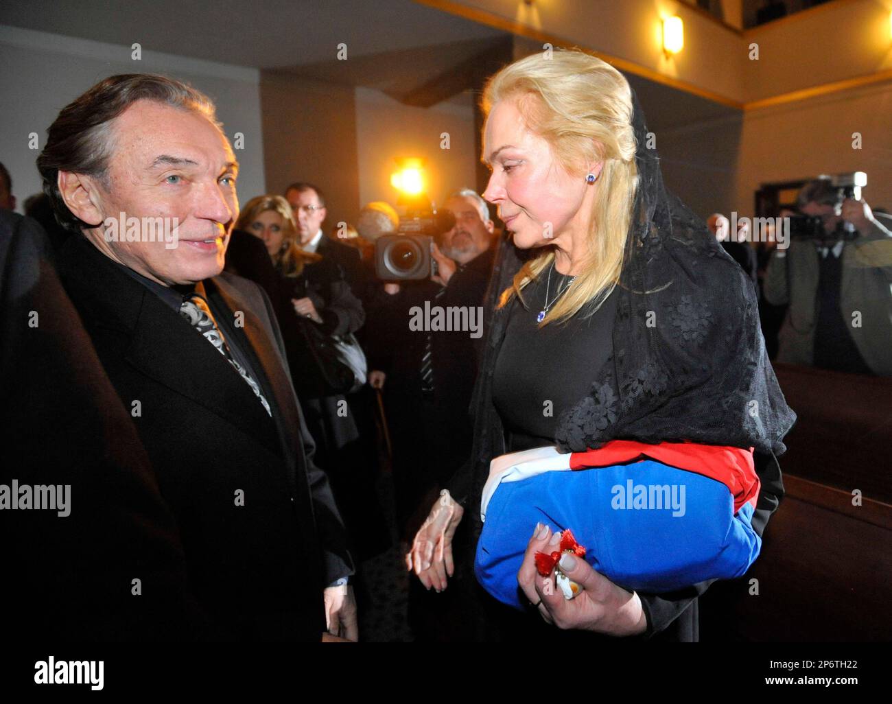 Czech singer Karel Gott, left, expresses his condolences to Havel´s