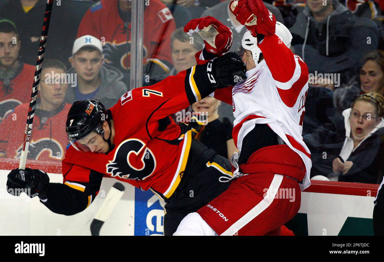 Detroit Red Wings Mike Commodore right checks Calgary Flames