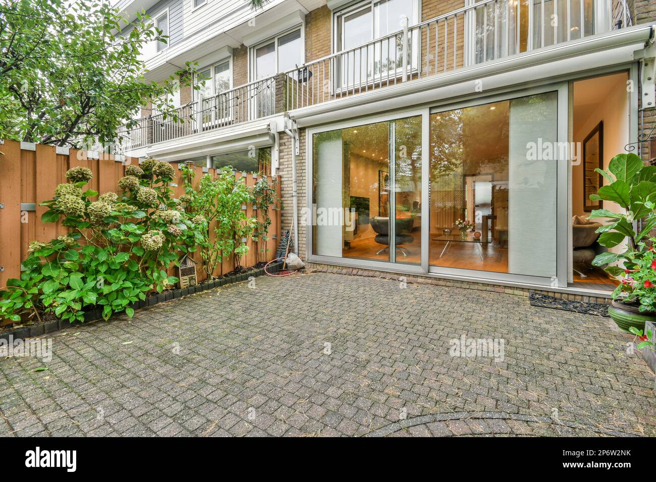 Amsterdam, Netherlands - 10 April, 2021: a brick patio with plants and ...