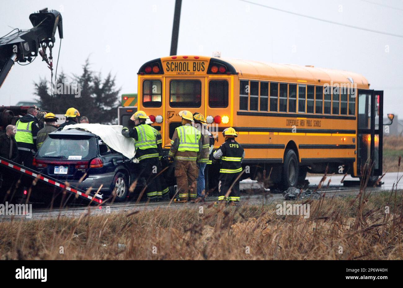 Emergency workers respond to the scene after a car struck a ...