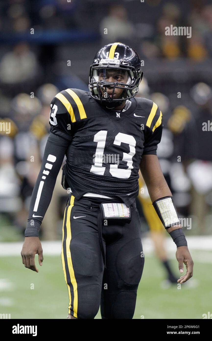 Neville High School quarterback John Diarse (13) looks to the sidelines