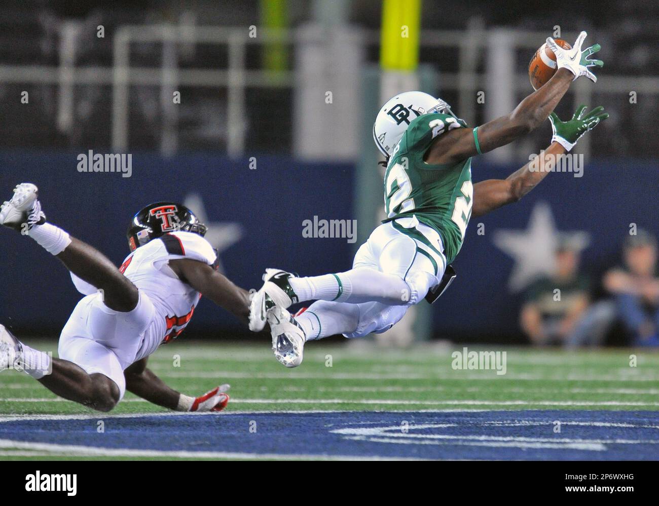 26 Nov 2011: .Baylor Bears quarterback Robert Griffin III (10) is hit hard  during the game between Texas Tech Red Raiders and the Baylor Bears at  Cowboy Stadium in Arlington Texas..Baylor wins