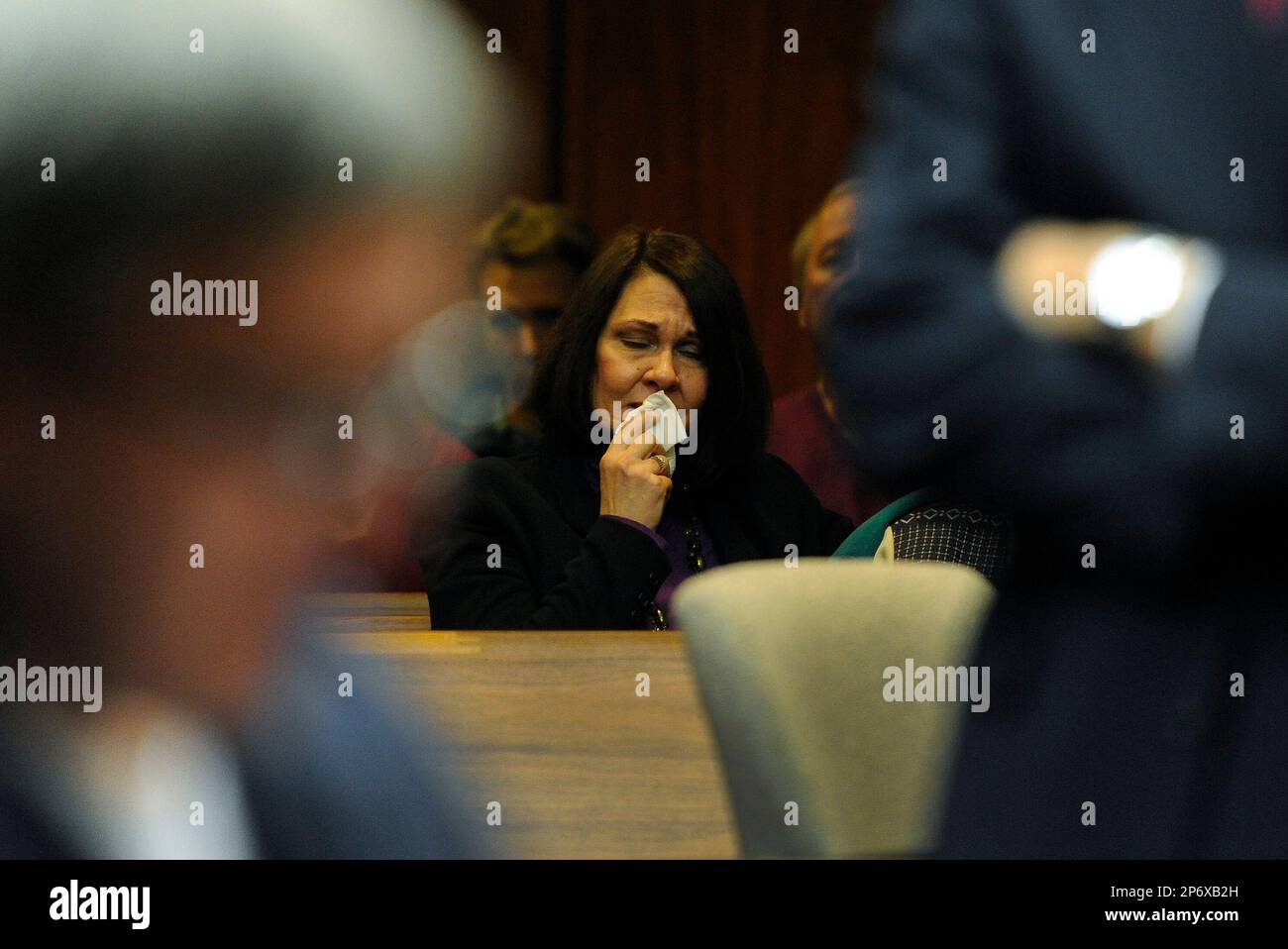 Renee center, second wife of defendant Michael listens
