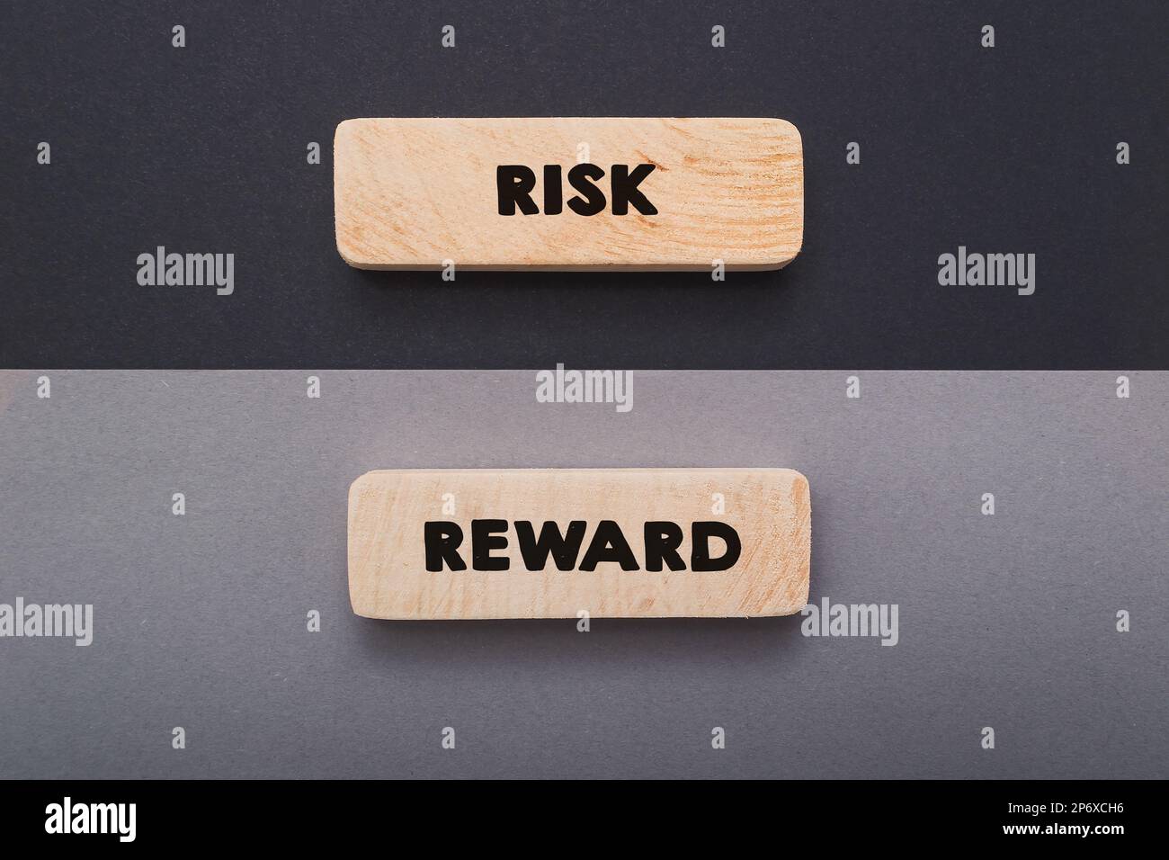 Wooden tablets with words Risk and Reward on dark background Stock Photo Alamy