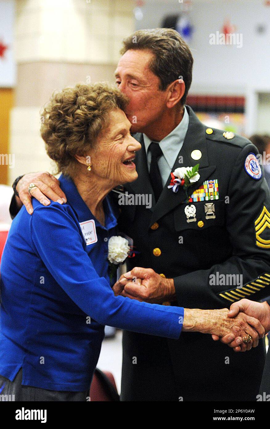 Robert Strickland kisses the forehead of Jamie Turner during the