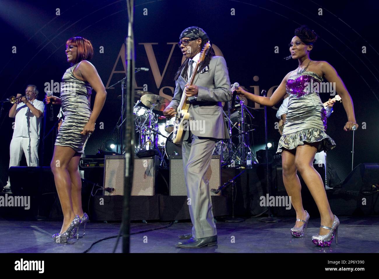 In this picture taken Nov. 9, 2011 American guitarist and producer Nile  Rodgers, center, performs with his band Chic on stage at the Avo Session in  Basel, Switzerland. (AP Photo/Keystone/ Georgios Kefalas