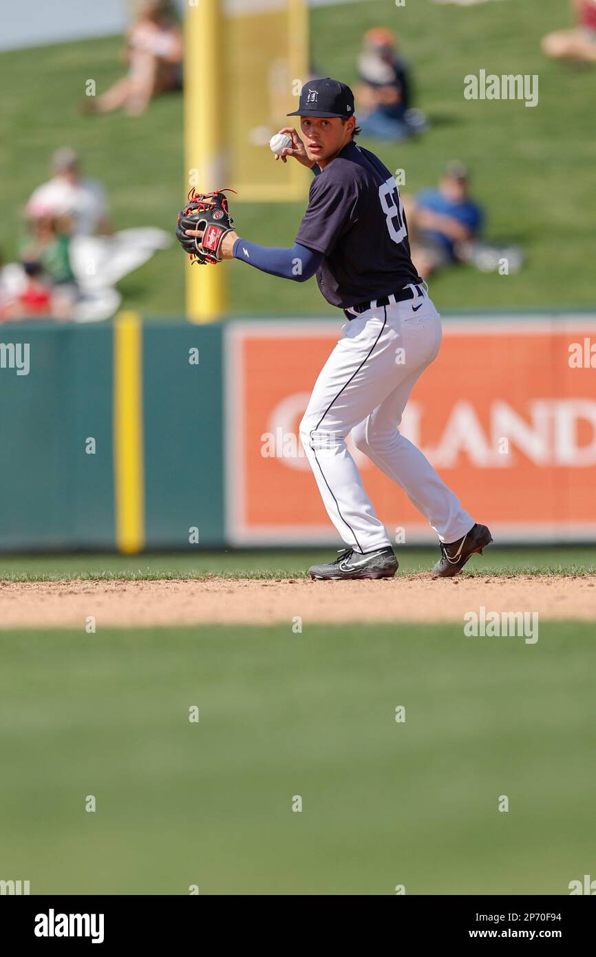 Lakeland FL USA; Detroit Tigers shortstop Danny Serretti (87) throws to first for the out during an MLB spring training game against the St. Louis Car Stock Photo
