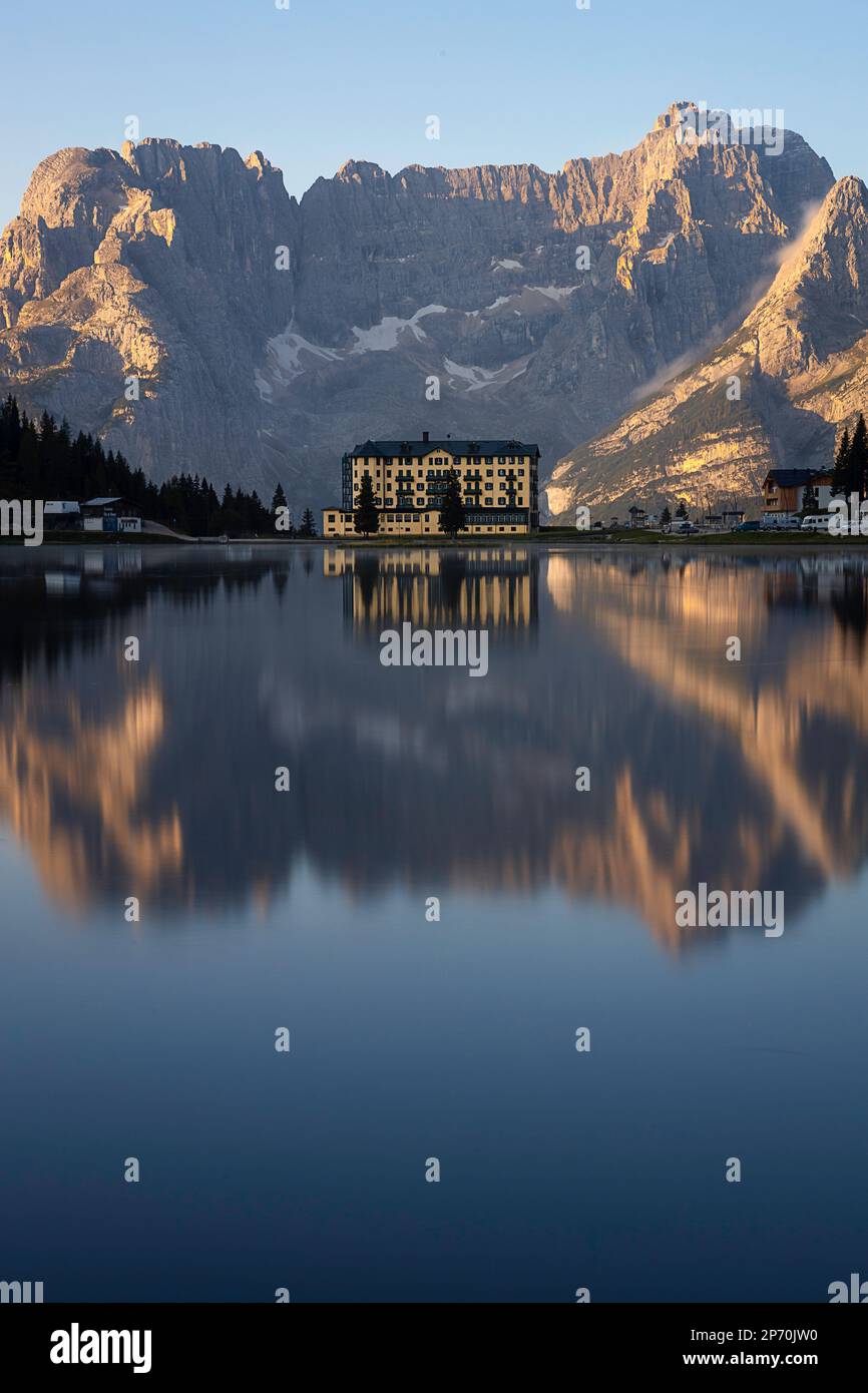 Picture of Pio XII hospital reflecting in Lake Misurina, Cortina d'Ampezzo, Italy Stock Photo
