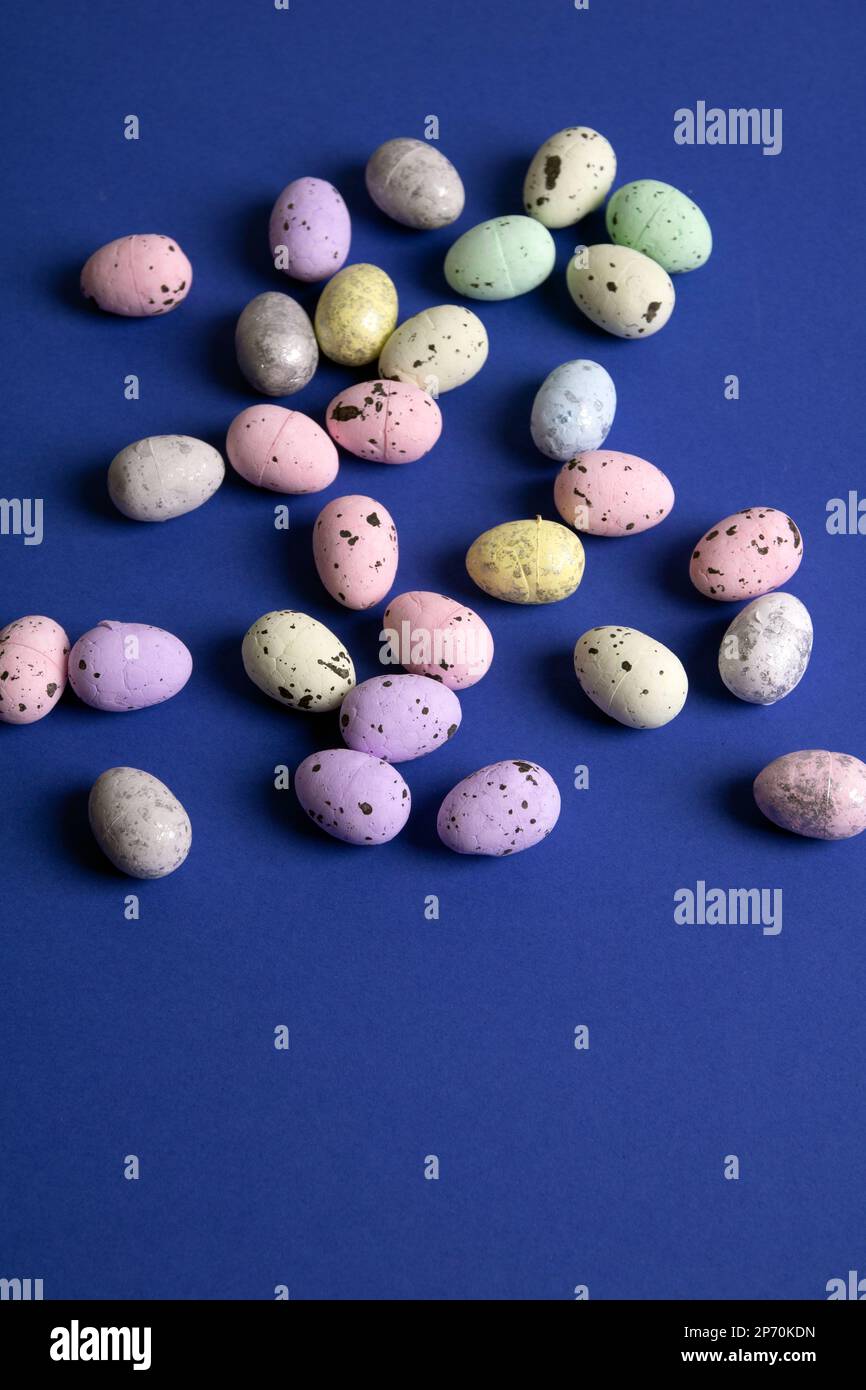 photo of many small eggs on a blue background Stock Photo