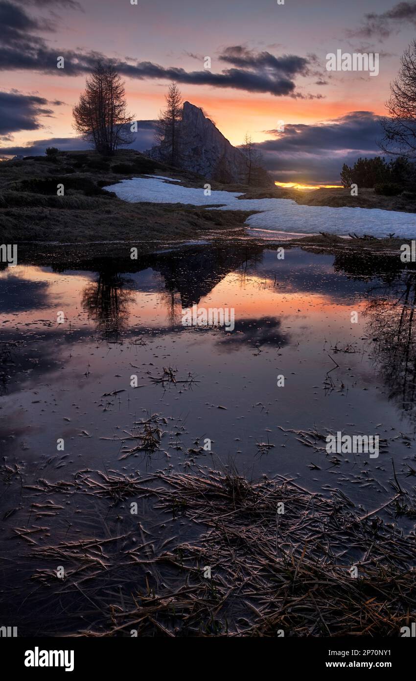 Picture of Mount Sass de Stria reflecting in a pond at sunset in Cortina d'Ampezzo, Italy Stock Photo