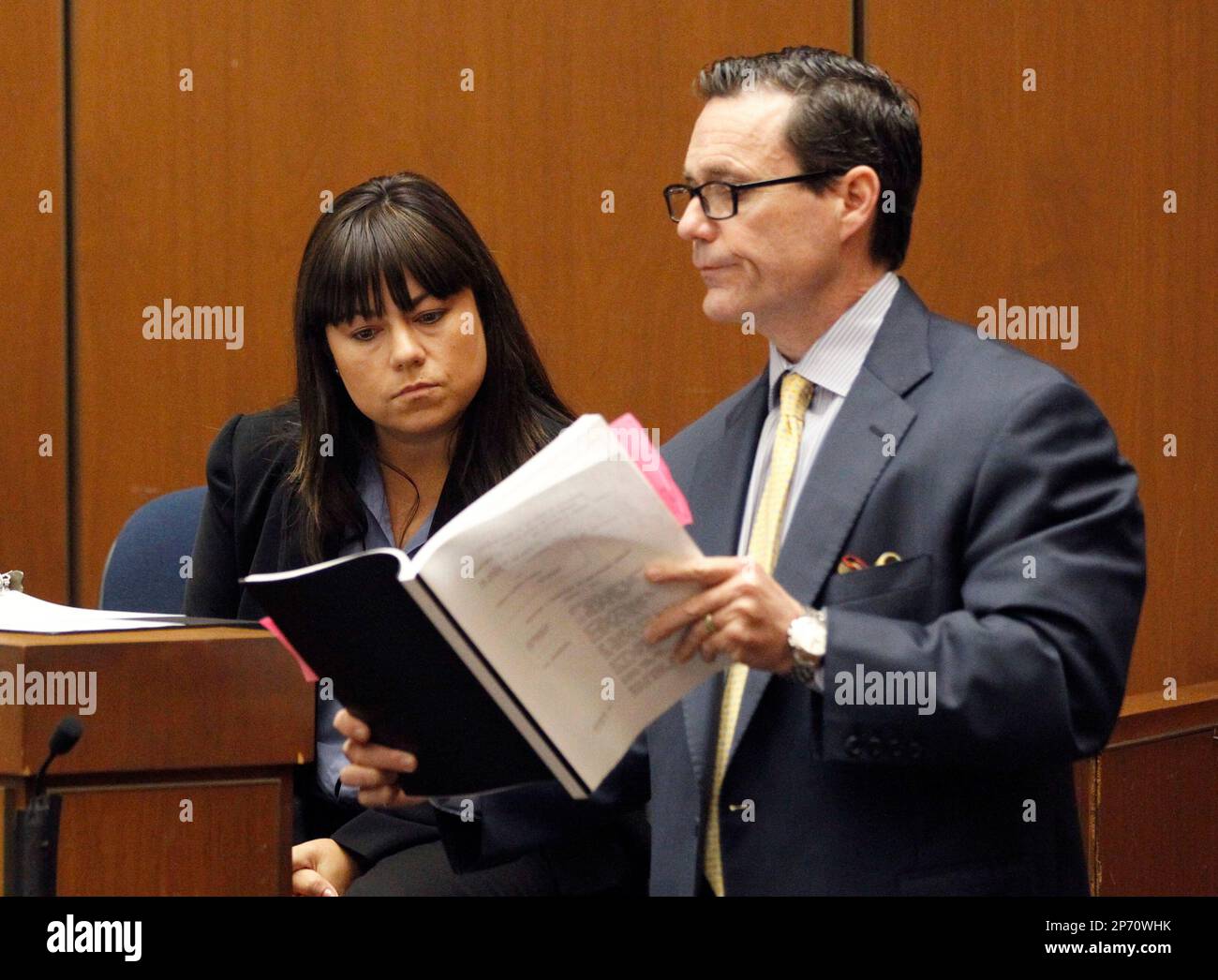 Los Angeles County coroner investigator Elissa Fleak is shown documents ...