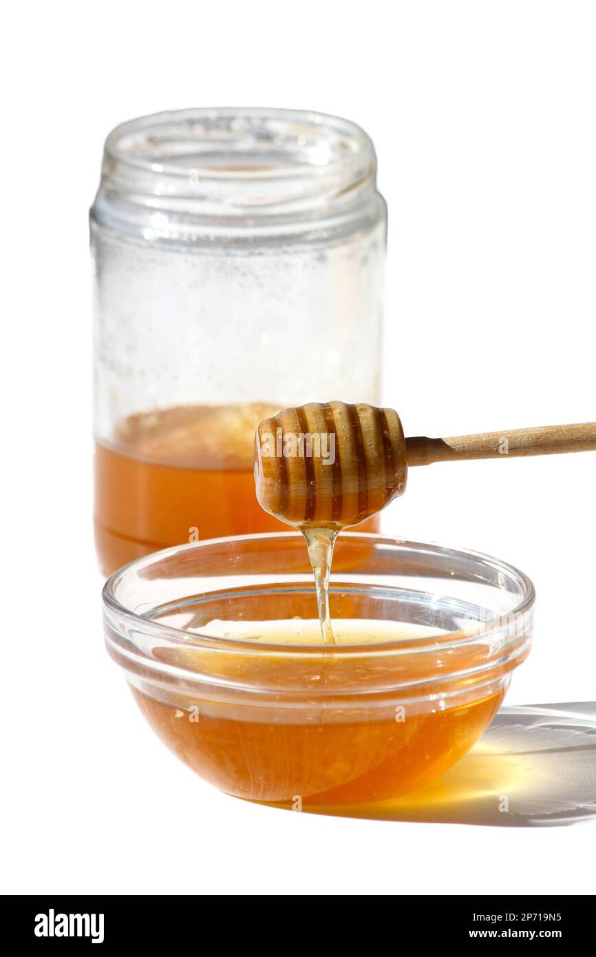 Honey Bowl with dipper and jar isolated on white Stock Photo - Alamy