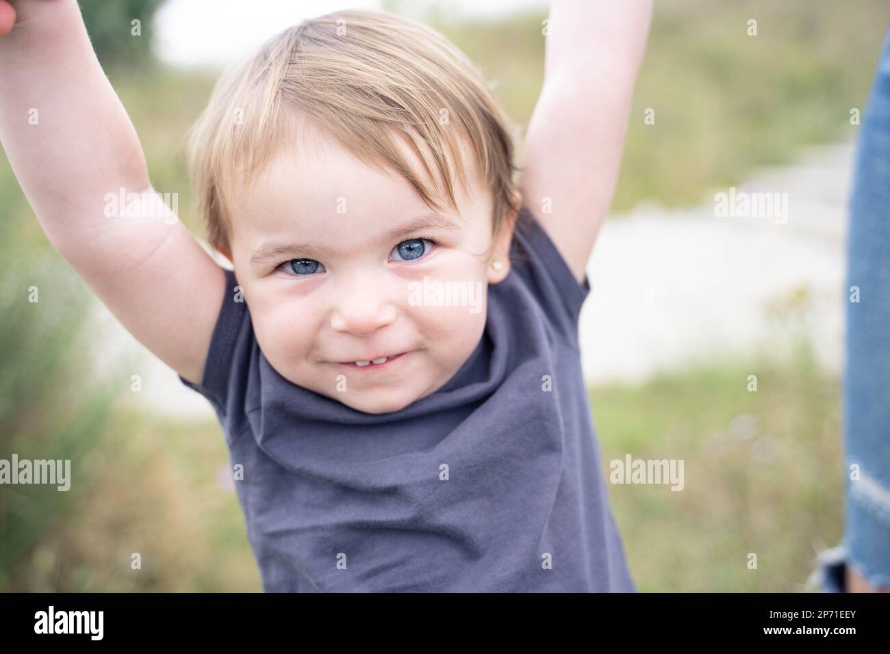 Close up portrait of a playful cute little girl smiling at camera Stock ...