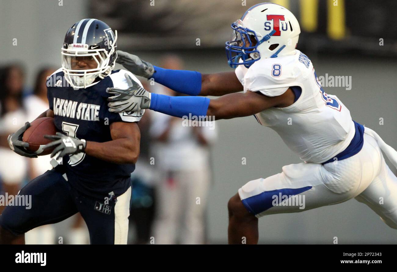 Jackson State running back B.J. Lee (3) picks up yardage while defended by  Tennessee State linebacker Wilson Robinson (8) during a football game  Saturday, Sept. 10, 2011, in Memphis, Tenn. (AP Photo/The