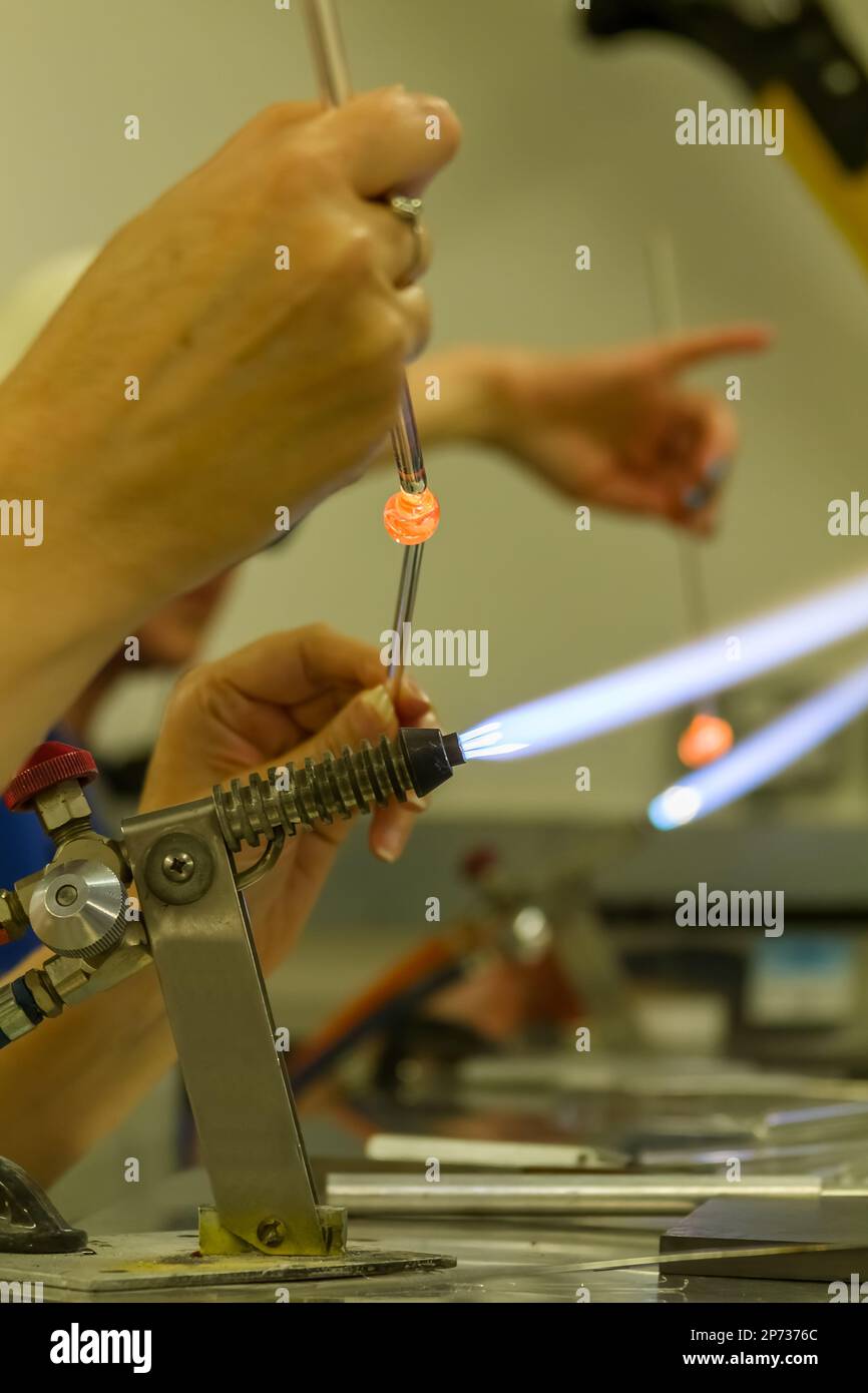 Glass bead making at a workshop stock photo alamy