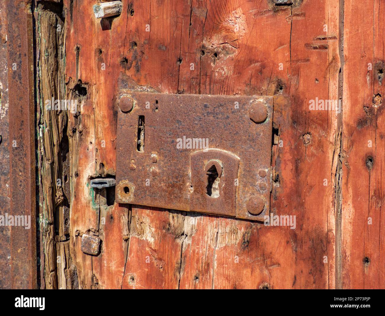 Old lock built into an even older door, seen in Valletta, Malta Stock