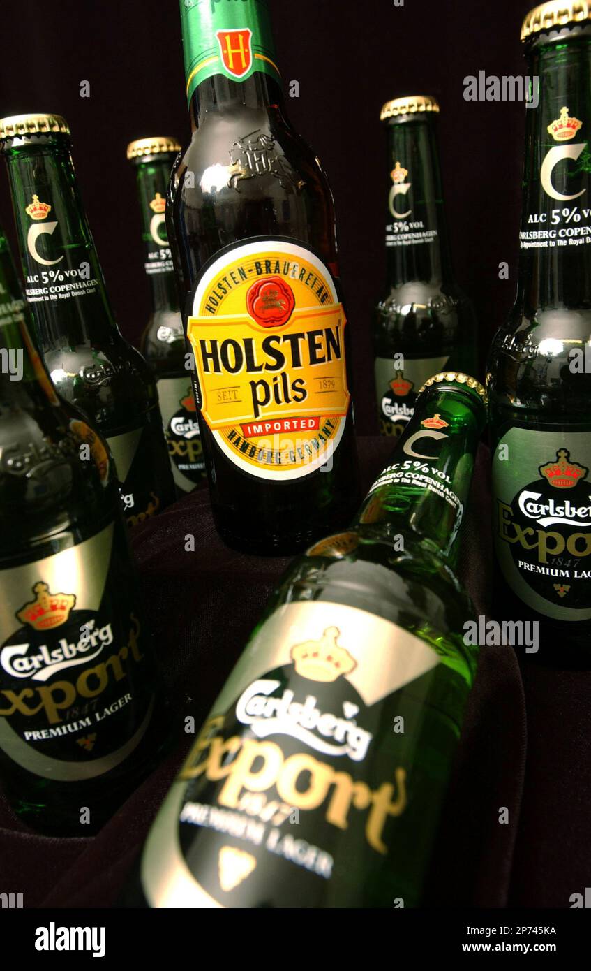 Pictured: A bottle of Holsten Pils, lager; a Carlsberg brand. (Newscast Limited via AP Images) Stock Photo