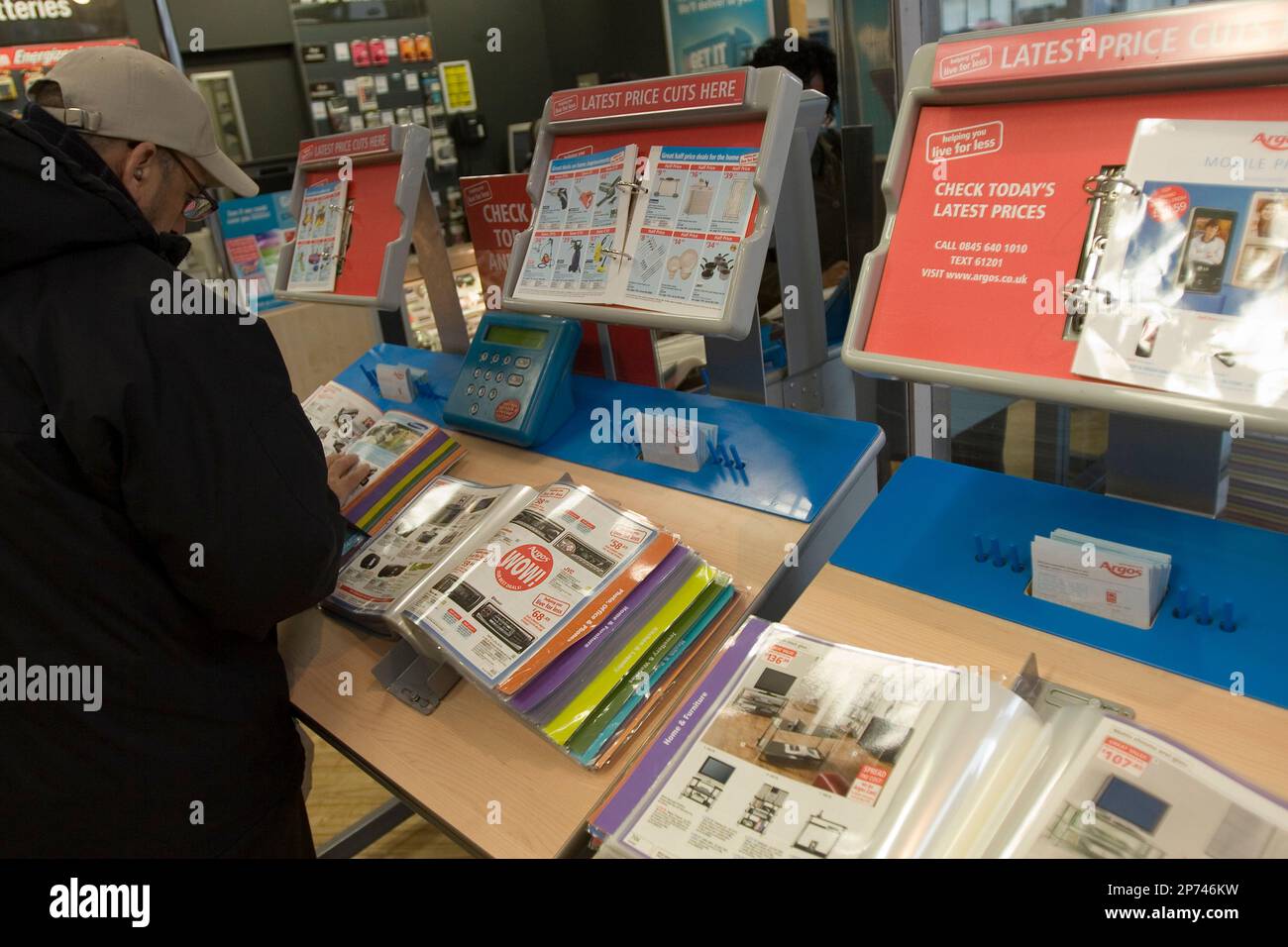 An Argos customer picking out the products he wants. Part of the Home ...
