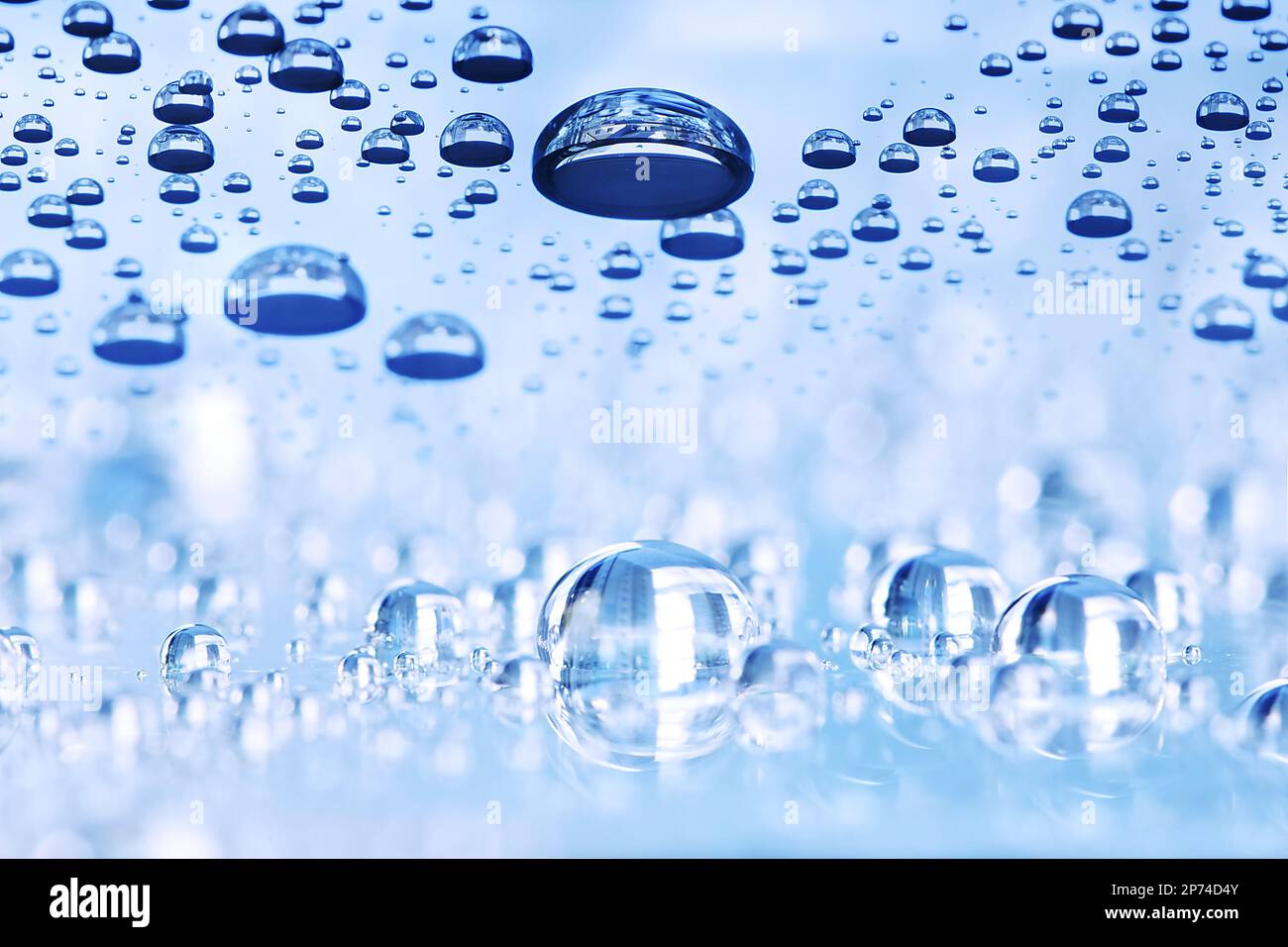 Blue water drops abstract background, perspective with bokeh Stock Photo