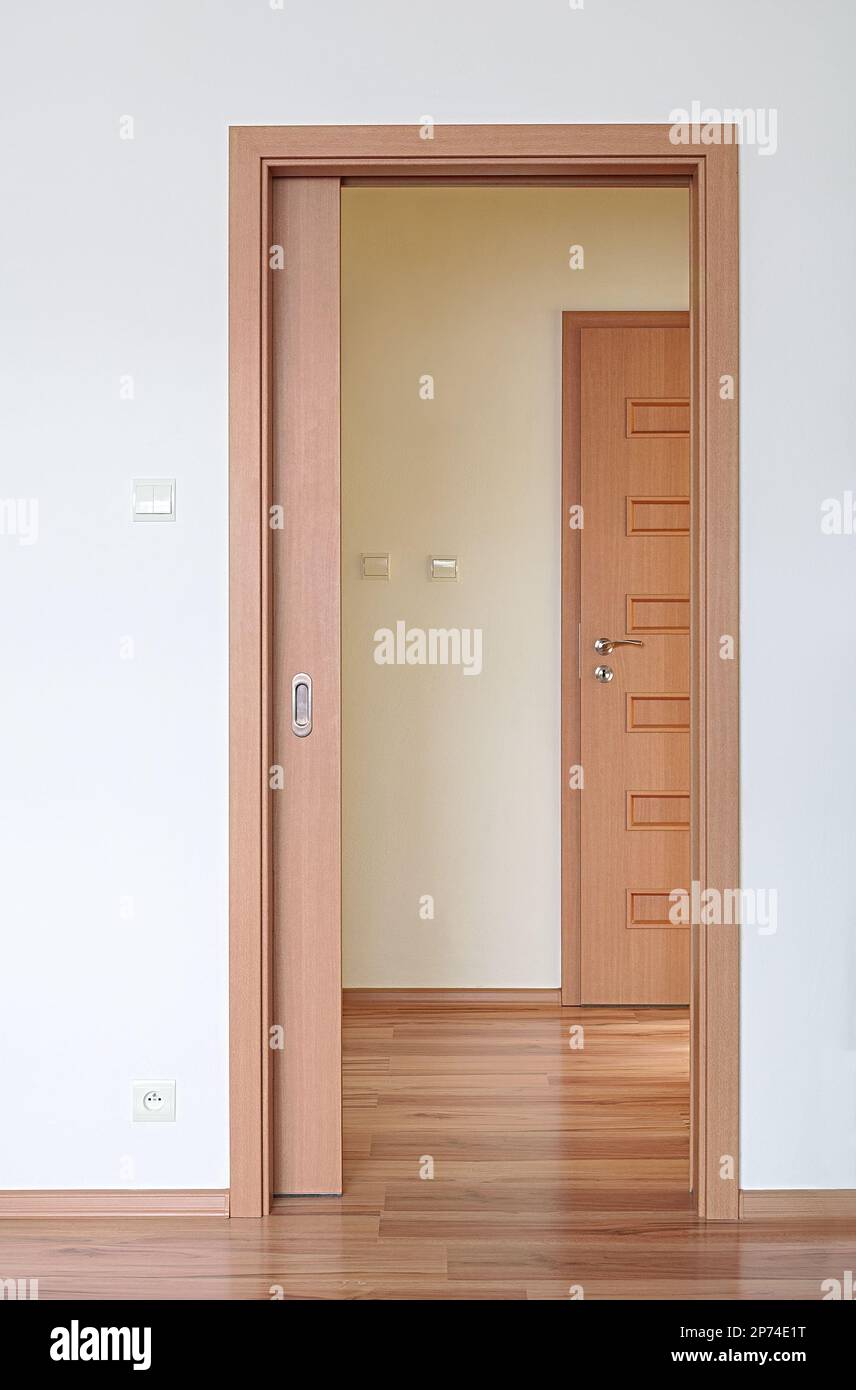 Room with sliding doors, space saving interior design maximize space in small rooms Stock Photo