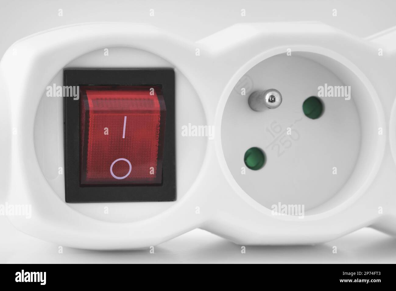 Electrical extension cord. White plug socket with switch Stock Photo