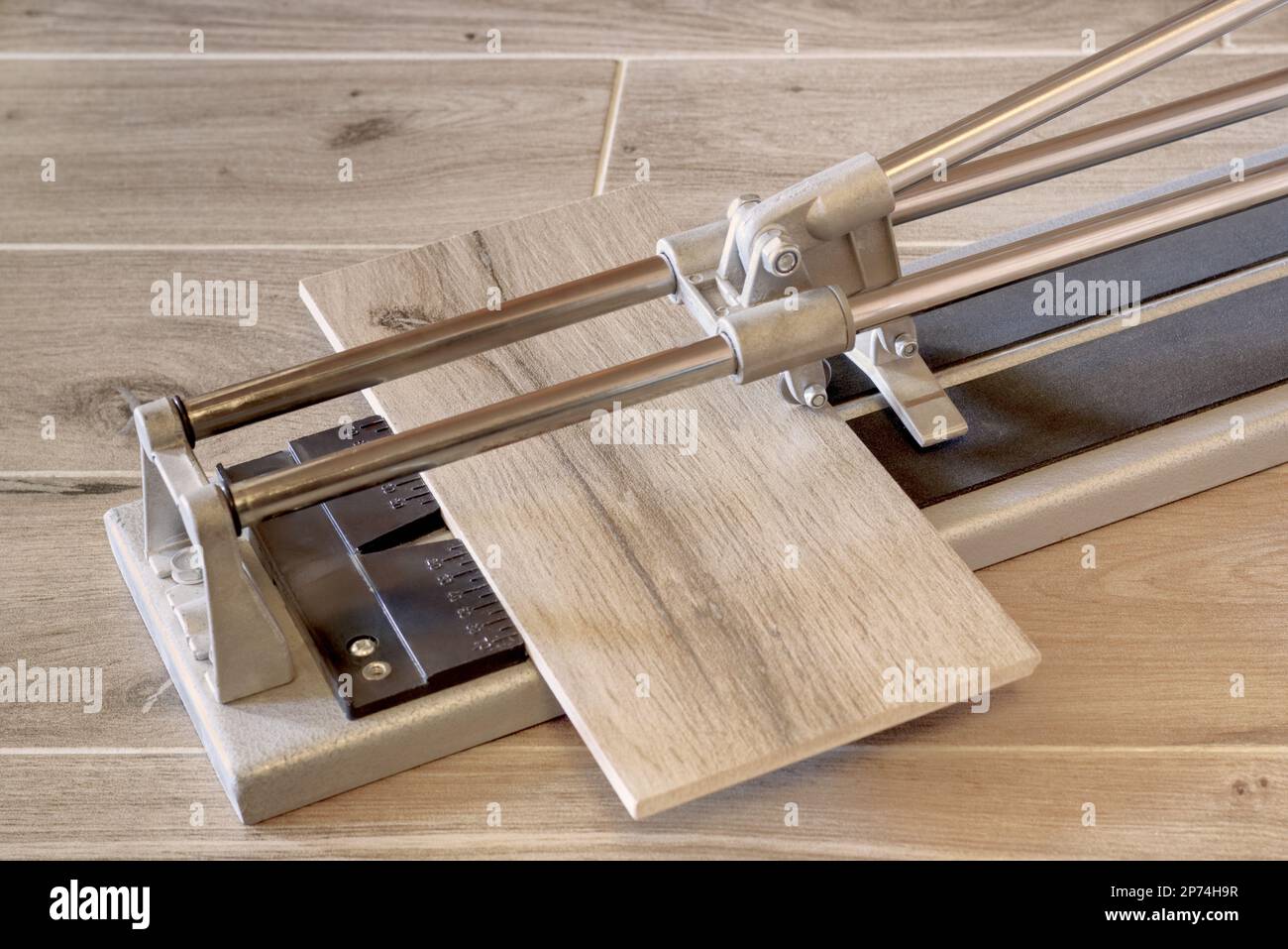 Hand tile cutter with tile Stock Photo Alamy