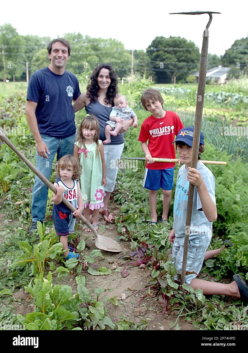 FOR RELEASE SATURDAY, JULY 23, 2011, AT 12:09 A.M. EDT - In this photo  taken July 8, 2011, Shawn and wife Geralyn Touhill with their children,  Shawn Jr,, 3-months, daughter Hayden, 5