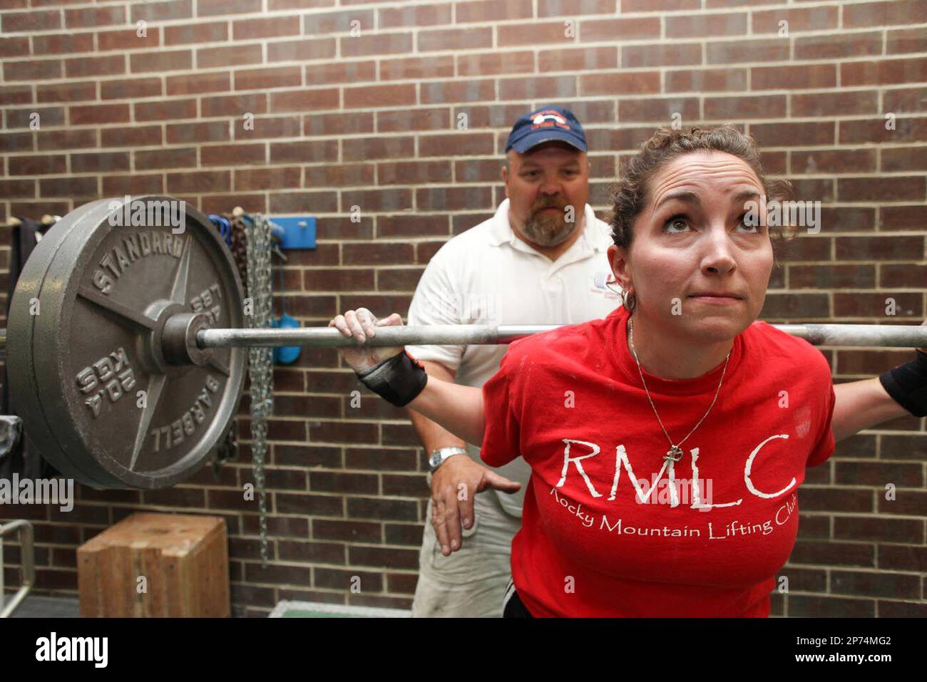 Jennifer Gaudreau poses with her husband Dan on July 11, 2011 at the Rocky  Mountain Lifting Club in Aurora, Colo. Running the gym is a fine balance  for Jennifer, a teacher, and